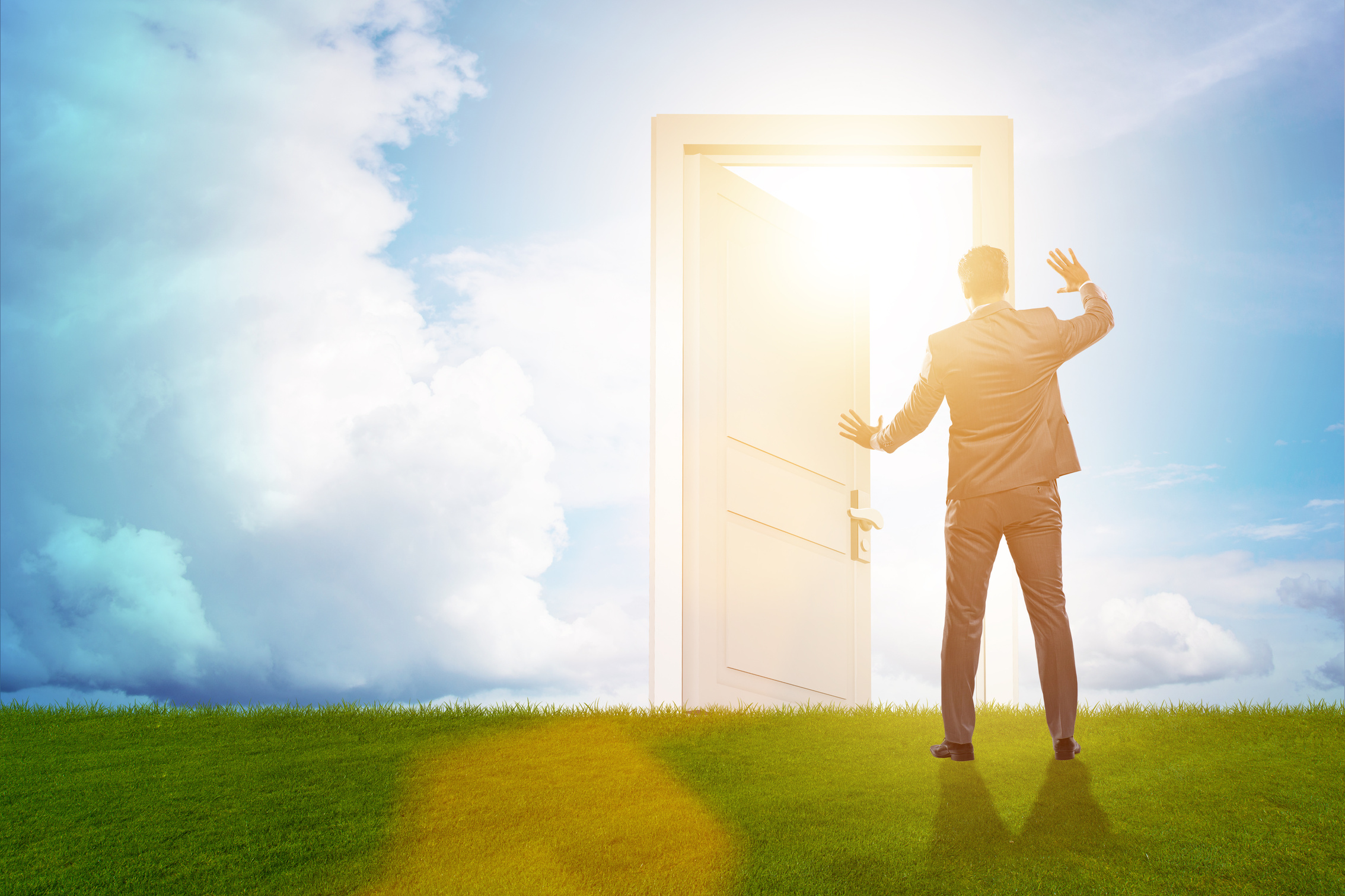 Businessman Standing in Front of Door into Future